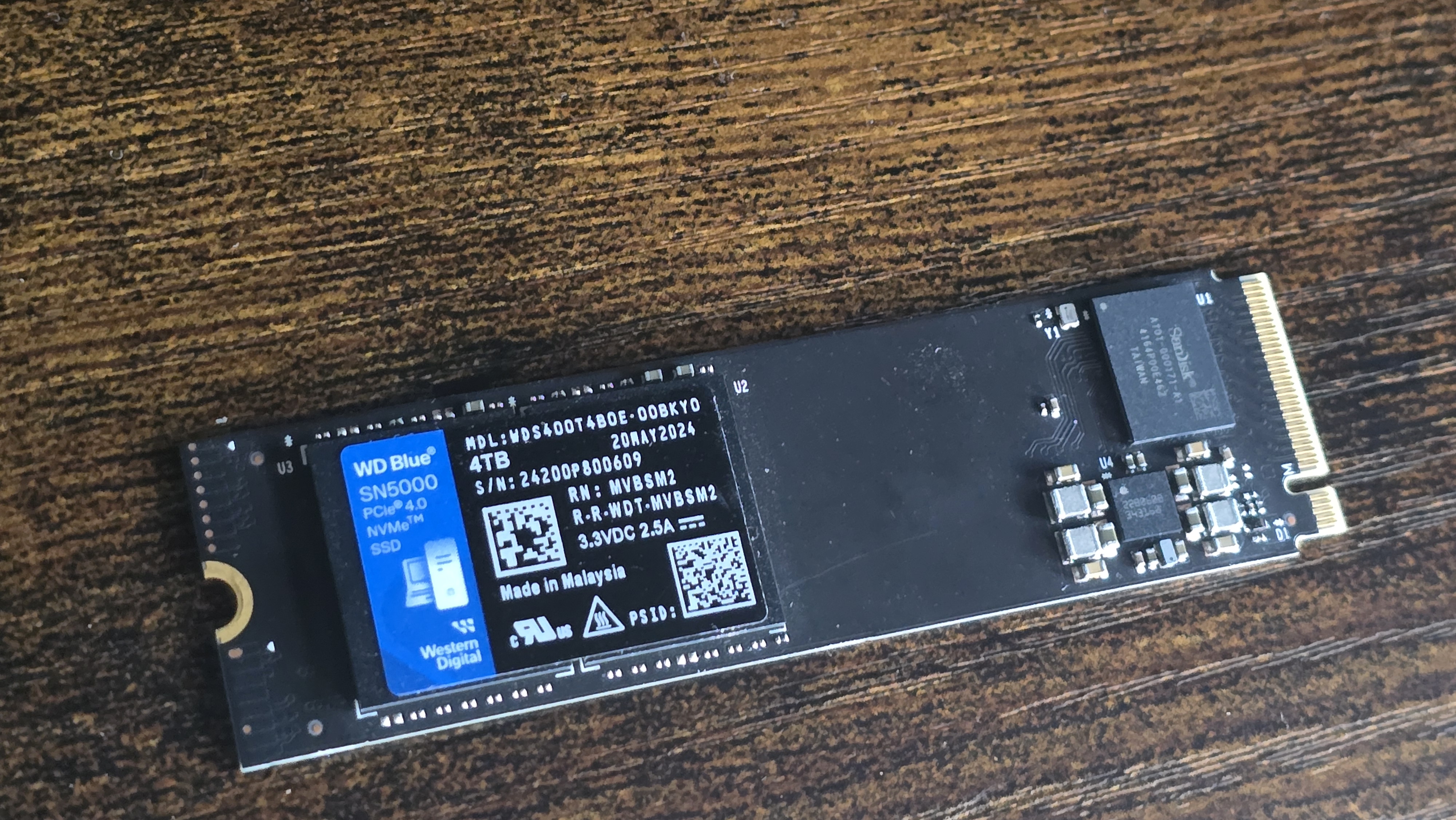 A WD SN5000 SSD out of its box and installed in a PC's NVMe slot.