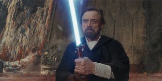 Luke Skywalker wielding his father's lightsaber on Crait
