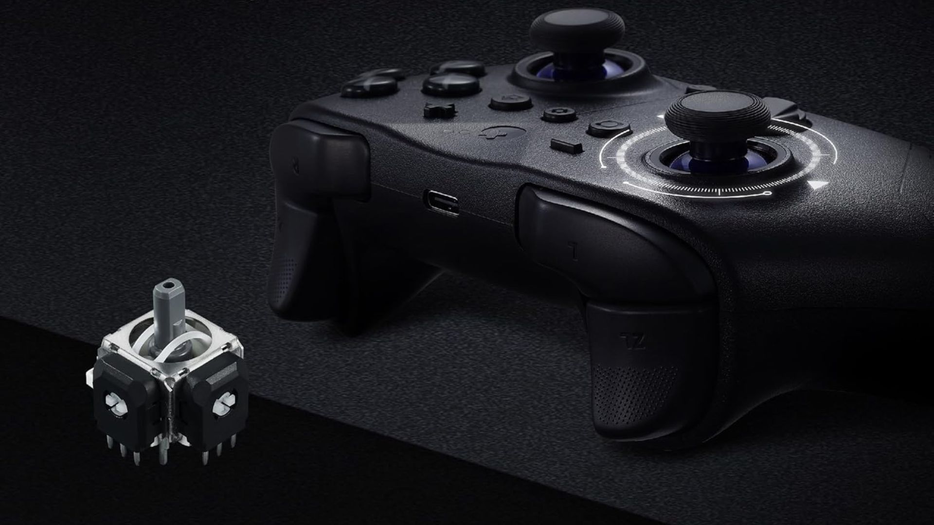 The black GuliKit ES Pro next to a TMR thumbstick module