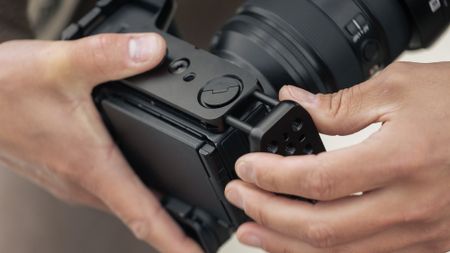 The Peak Design Field Bracket being used by a photographer