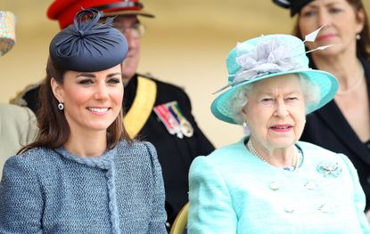 Catherine, Duchess of Cambridge and Queen Elizabeth II are seen talking during a visit to Vernon Park