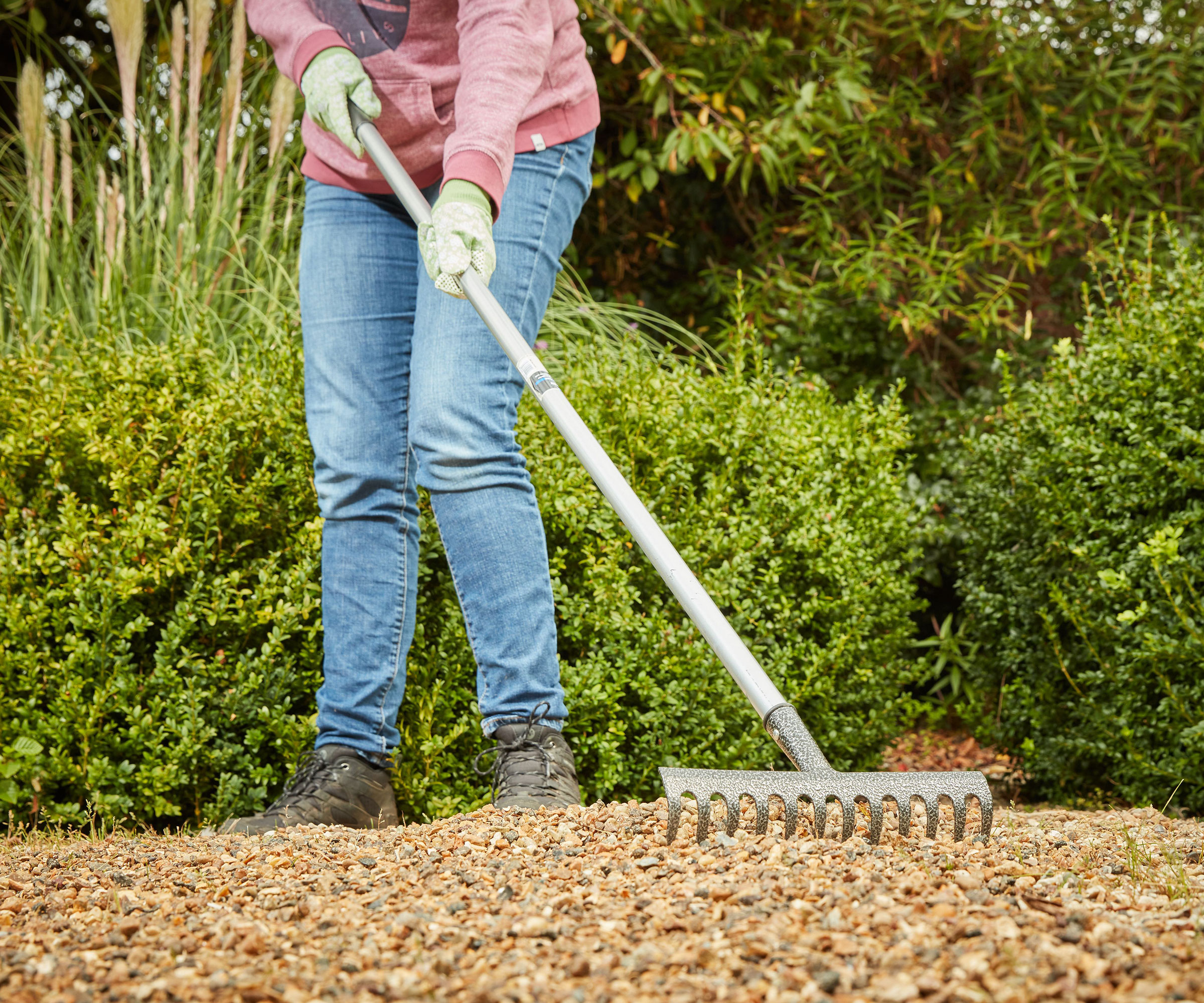 A woman digging gravel