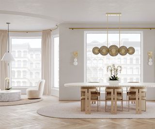 open plan living dining area with statement light above dining table, pendant light above coffee table and wall lights