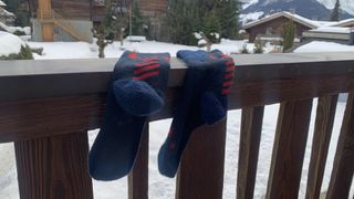 Helly Hansen Alpine Technical socks hanging on a balcony