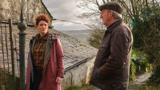 Cast of ITV Pictures Adrian Dunbar and Bronagh Waugh on a farm