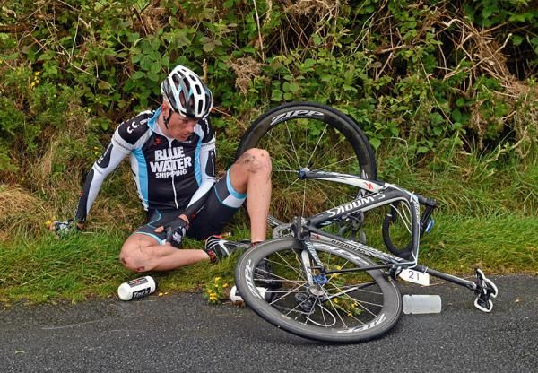 Jacob Nielsen (Blue Water Cycling) lies injured following a crash on the approach to Tourmakeady.