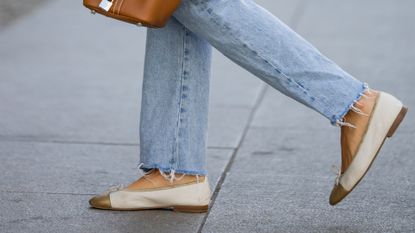 Woman walking in comfortable tan flats.