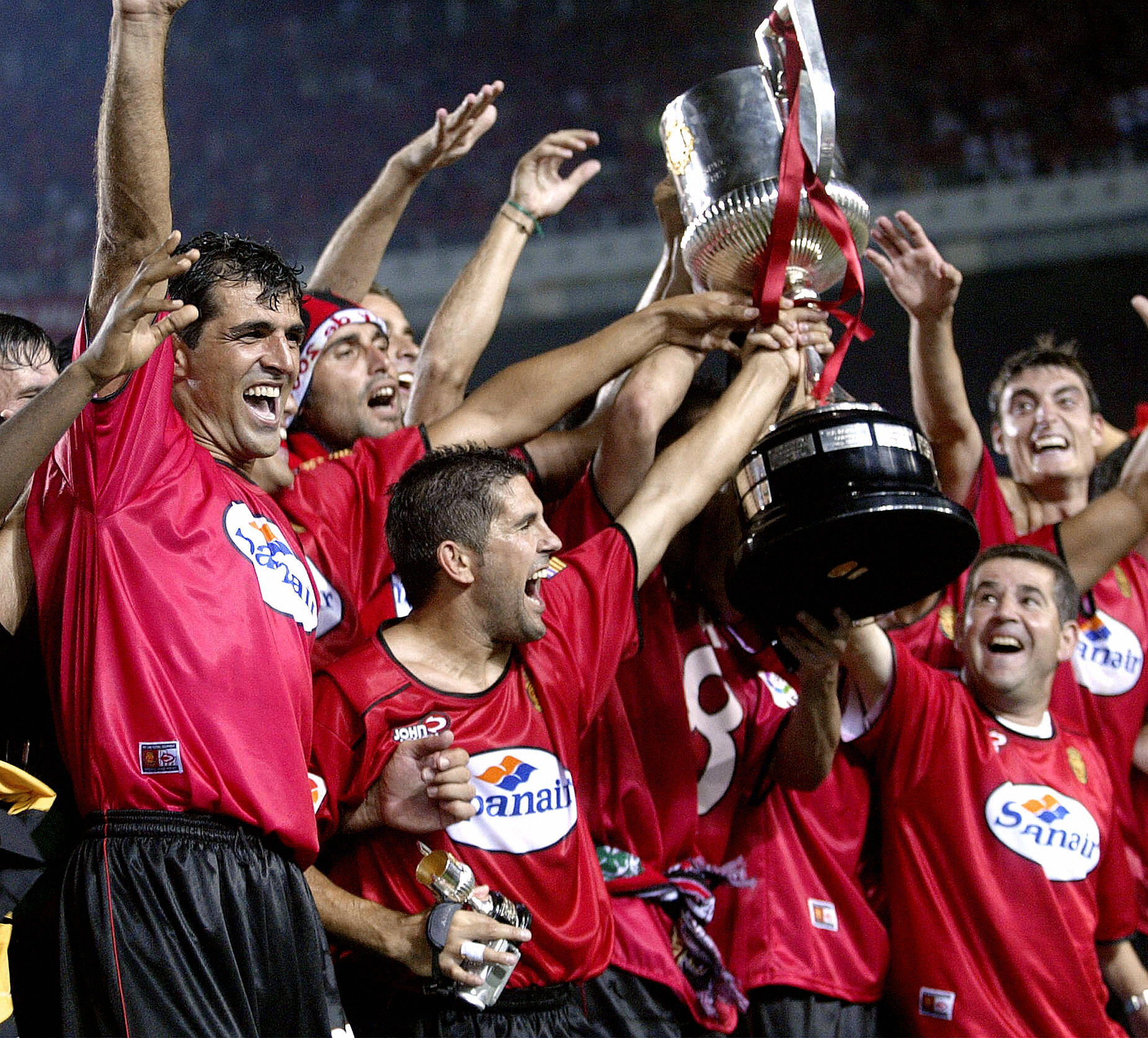 Mallorca players celebrate their Copa del Rey final win over Recreativo Huelva in June 2003.