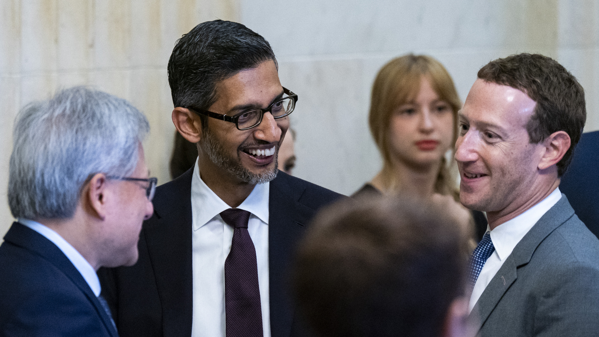 Jensen Huang, Sundar Pichai and Mark Zuckerberg speaking to each other