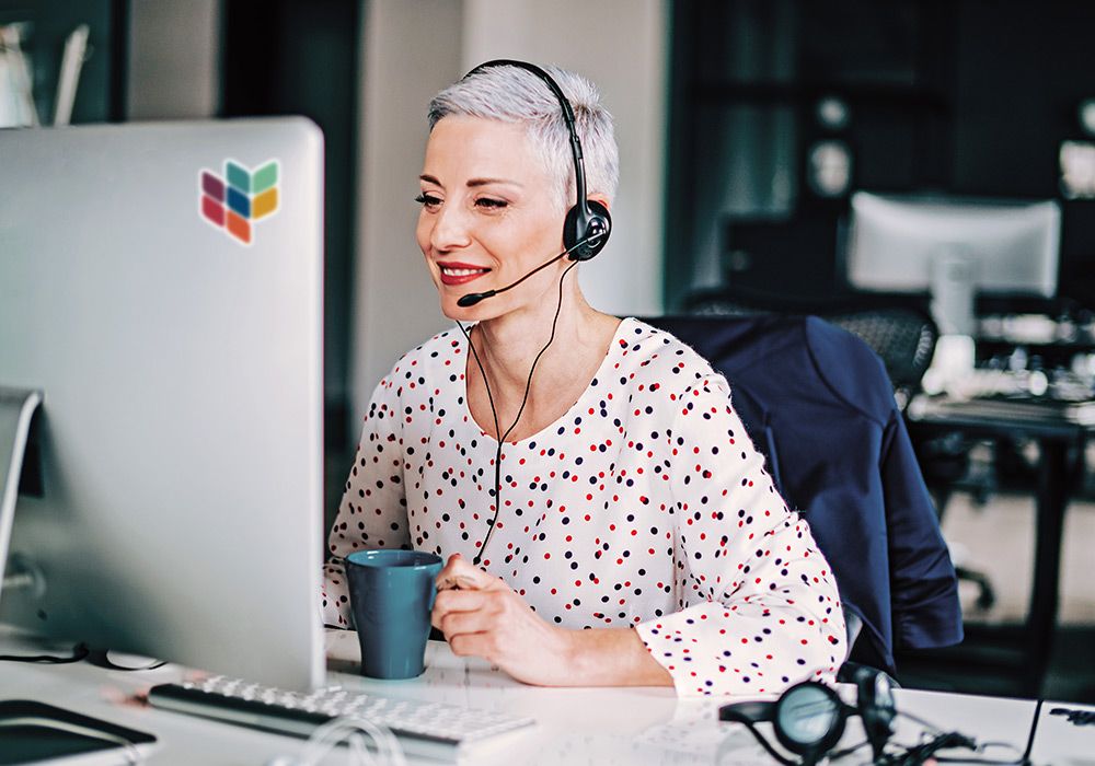 A person using video conferencing on a desktop PC.