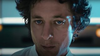 Jeremy Allen White stares ahead with an almost blank expression in The Bear.