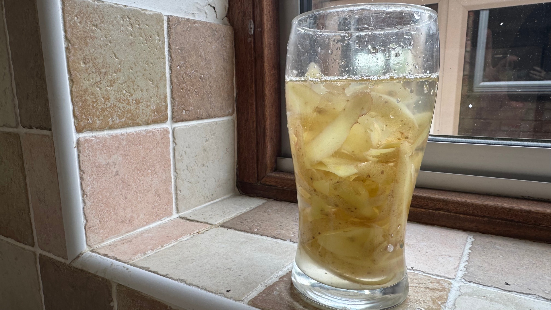 Potato peel in a glass with water
