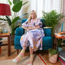 Fearne Cotton in her home, in front of a window and with colourful furniture around her
