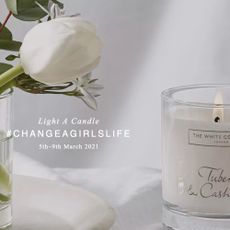 white background with spring candle and white roses