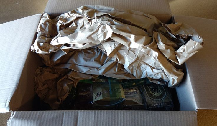 This company used crumpled butcher paper as a packing material to secure the basket inside the shipping box.
