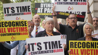 Campaigners on the streets reflecting issues raised in "The British Blood Scandal: Poisoned at School"