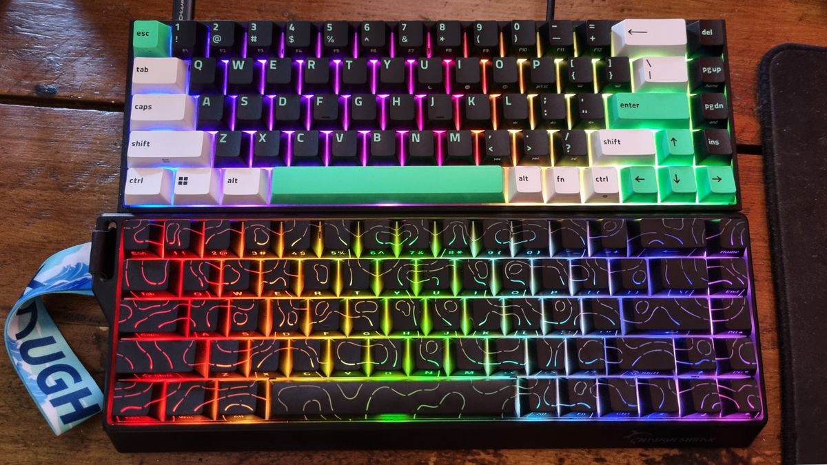 A Razer Reclusa X Mini 65% gaming keyboard above a Gamakay x NaughShark NS68 on a desk