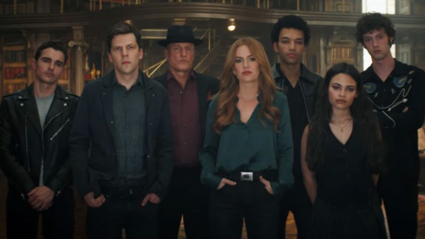 From left to right: Dave Franco, Jesse Eisenberg, Woody Harrelson, Isla Fisher, Justice Smith, Ariana Greenblatt and Dominic Sessa standing as a group in Now You See Me 3. 