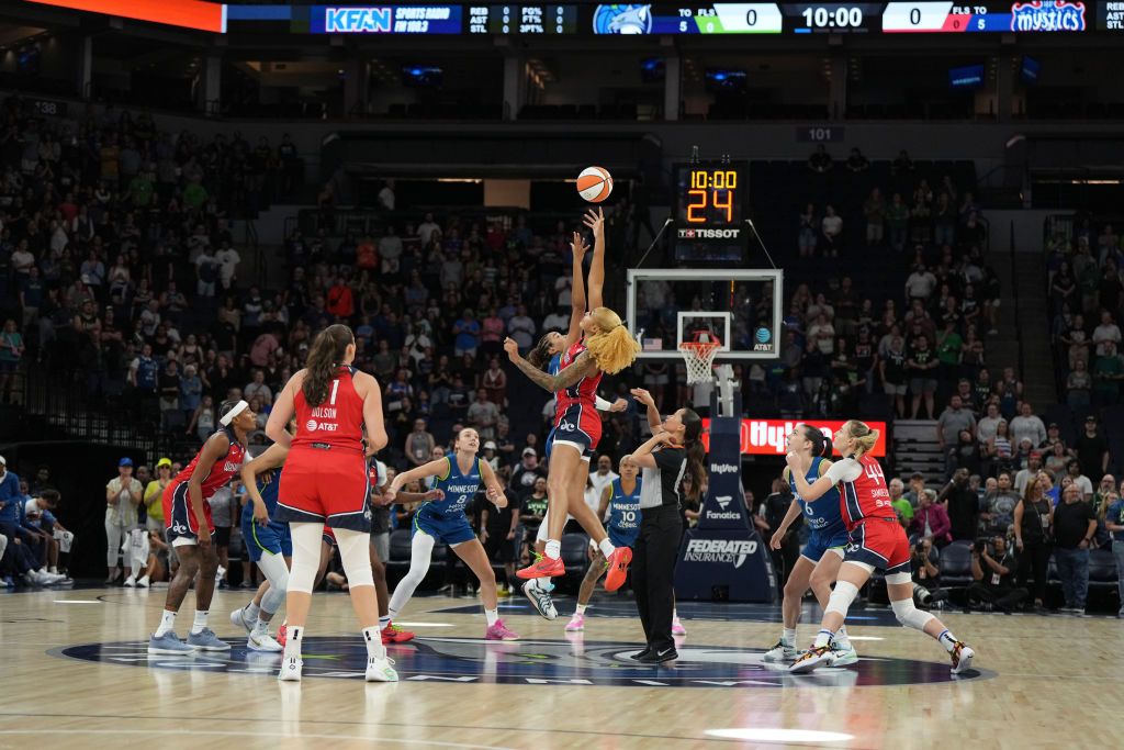 Open tip-off between Shakira Austin #0 of the Washington Mystics and Napheesa Collier #24 of the Minnesota Lynx on August 15, 2024