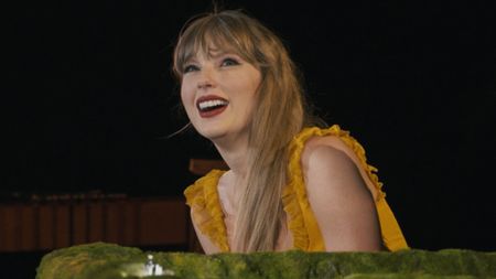 Taylor Swift is shown on her Eras Tour concert film.