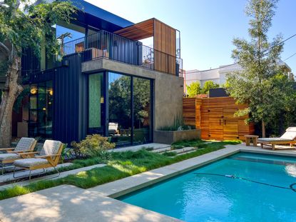 a modern garden with a pool and red fescue grass