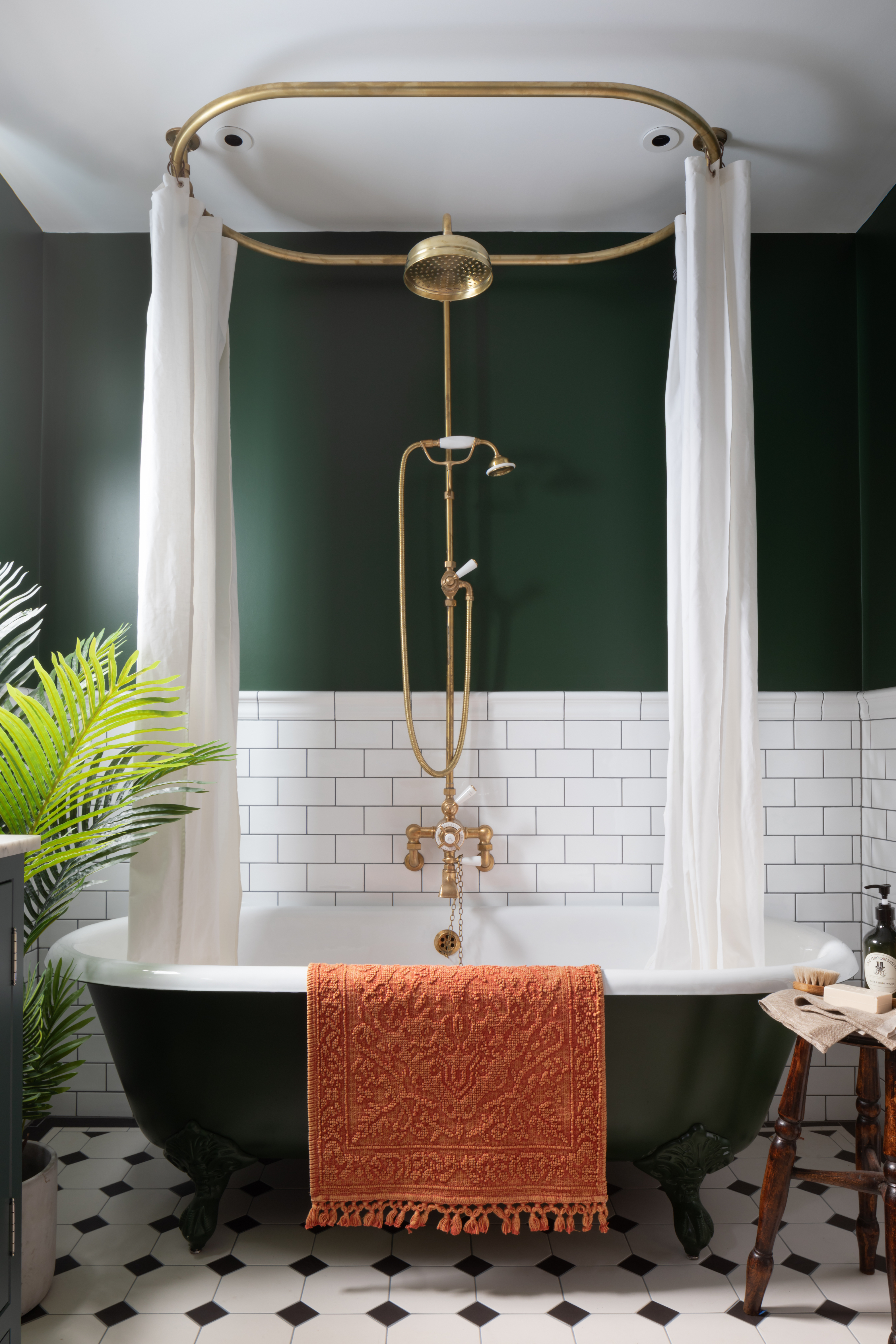 Family bathroom with dark green walls