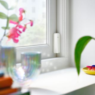IKEA smart sensor on a window with windowsill