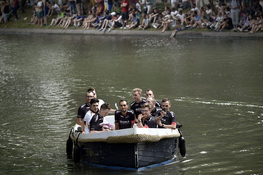Germany's Bora-Argon 18 cycling team arrive on a canal boat to attend the team presentation