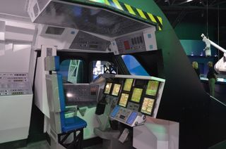 Visitors can also sit in the commander's chair in a mock-up of a space shuttle flight deck, where the pilot and commander guide the vehicle.