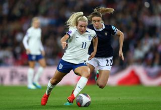 Lauren Hemp of England battles for possession Christy Grimshaw of Scotland during the UEFA Women's Nations League match between England and Scotland at Stadium of Light on September 22, 2023 in Sunderland, England. (Photo by Naomi Baker - The FA/The FA via Getty Images)