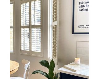 Neutral kitchen with open window and shutters