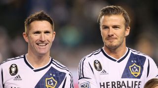 Robbie Keane and David Beckham of Los Angeles Galaxy line up prior to the first leg of the MLS Western Conference Championship match against Seattle Sounders on November 11, 2012 in Carson, California, USA.