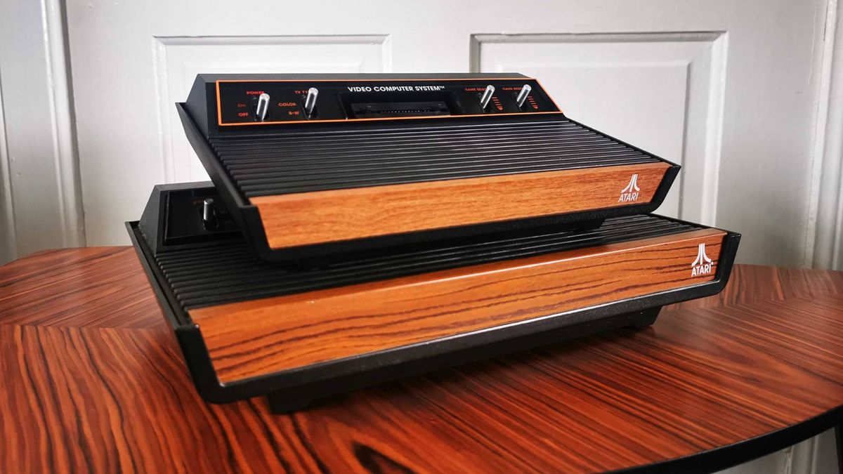 Atari 2600 Plus console sitting on top of original