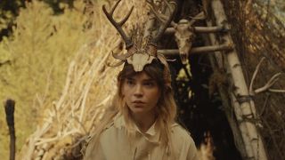  natalie in antler queen headwear at Coach's trial in Yellowjackets Season 2 