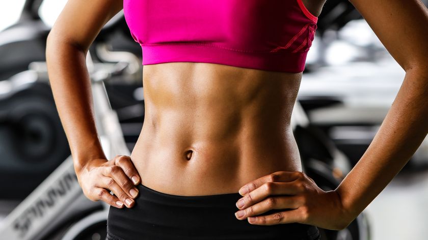 a photo of a woman with strong abs