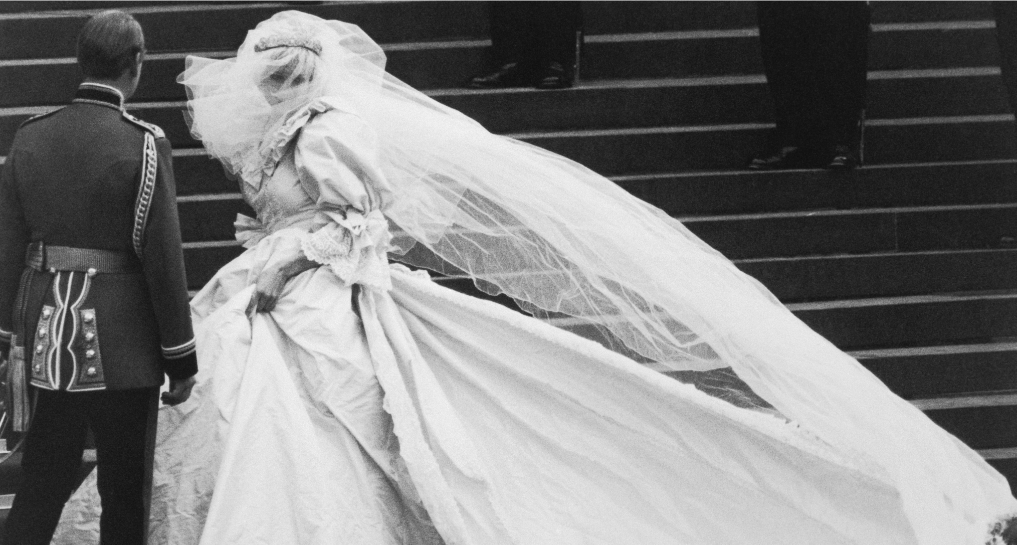 Princess Diana walking in her wedding dress and veil