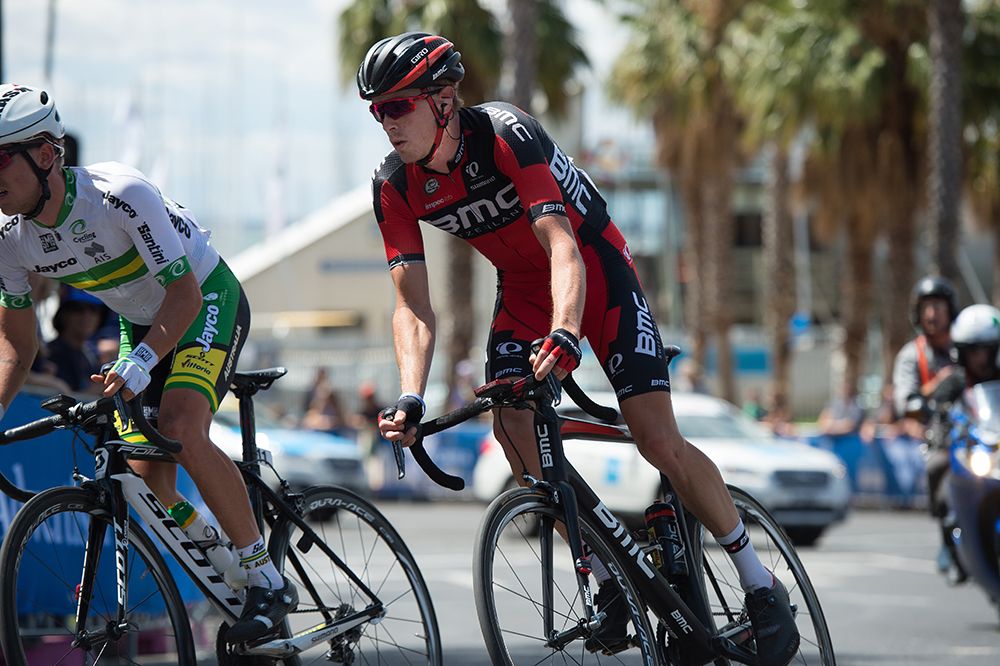 Rohan Dennis stands on the pedals
