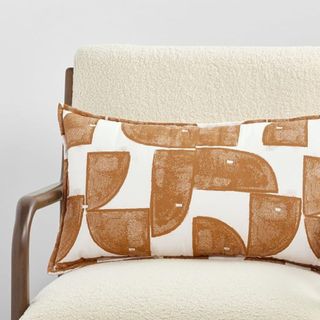 A bright patterned throw pillow from Nate Home