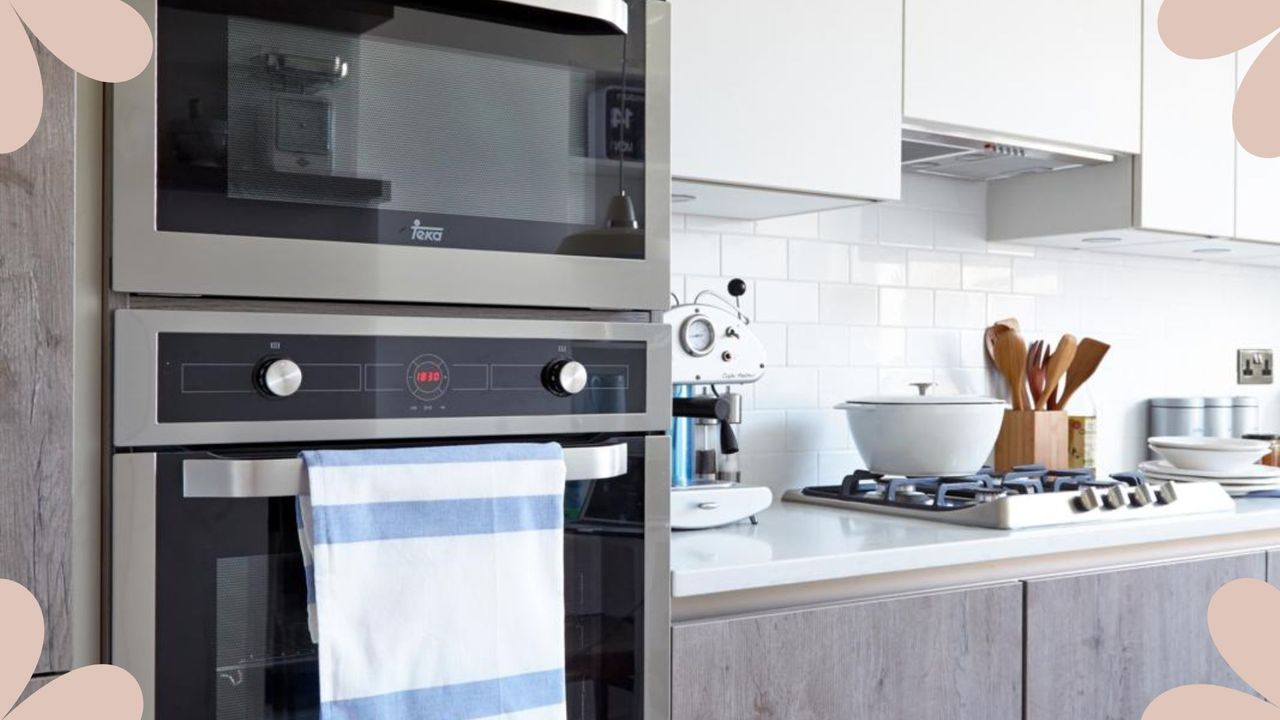 Built-in oven in rustic wooden kitchen with white worktops used to illustrate a woman&amp;home article on &#039;how often should you clean your oven&#039;