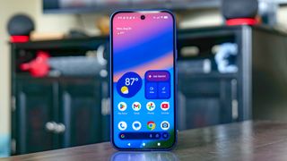 Google Pixel 10 in the hand.