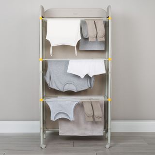 Neutral fabric screened clothes airer with laundry drying