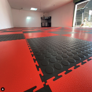 PVC is very durable and the studded texture adds a lot of grip to the floor ideal for a garage or workshop.