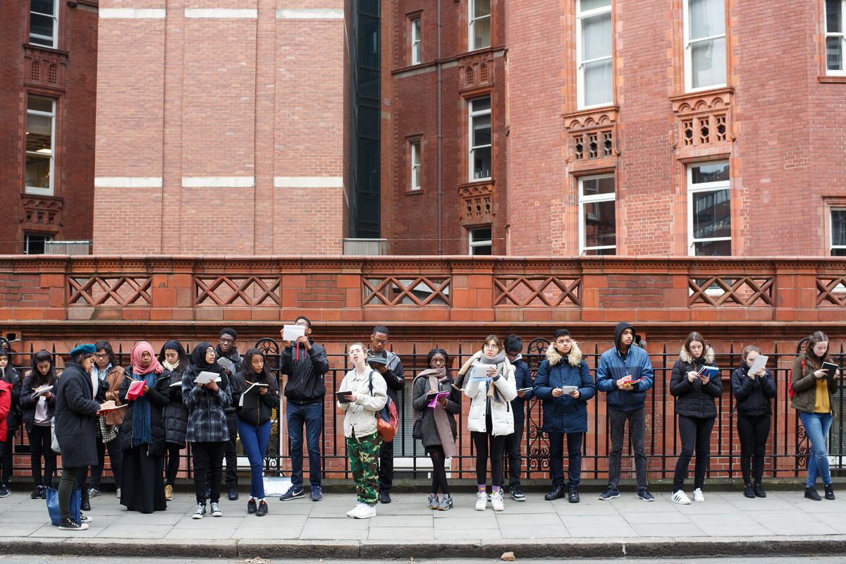 Young people looking at building