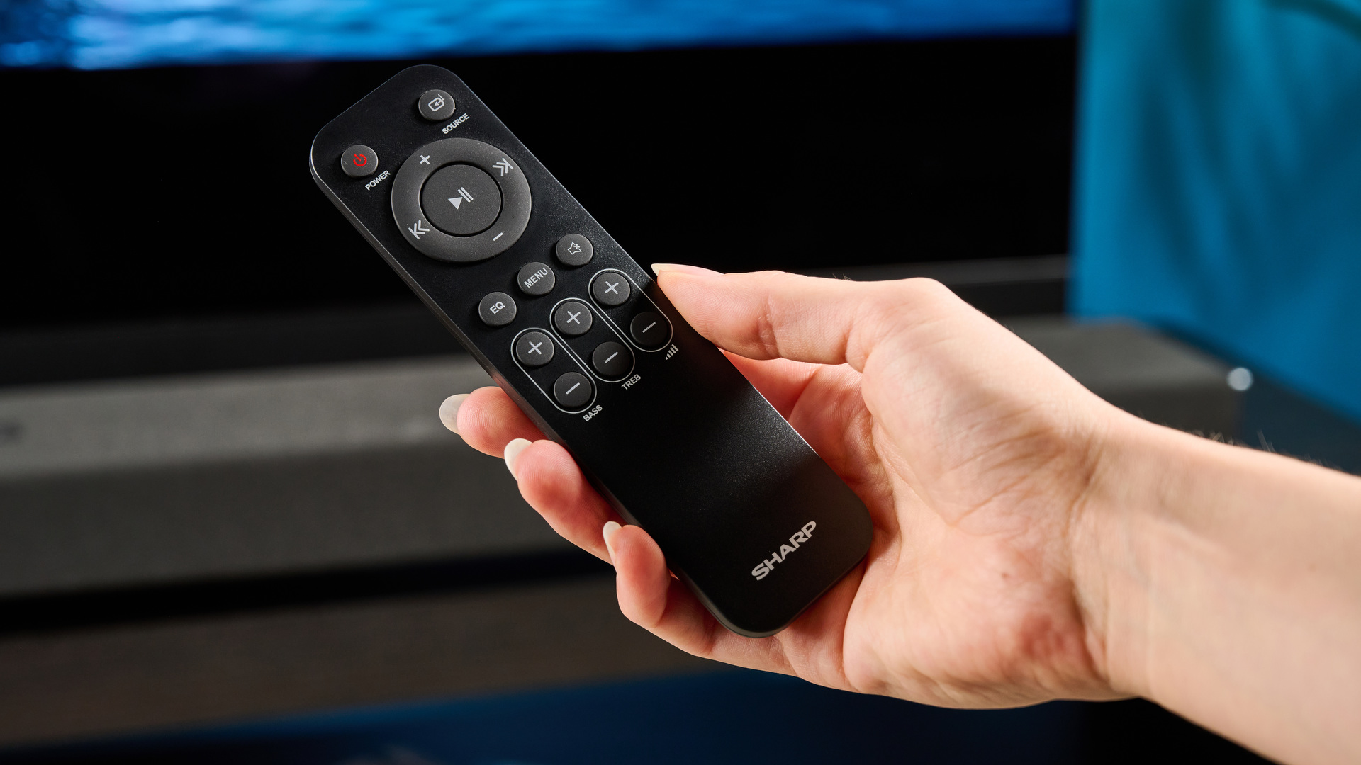 The Sharp 5.1.2 HT-SBW55121 Soundbar photographed in front of a blue background.