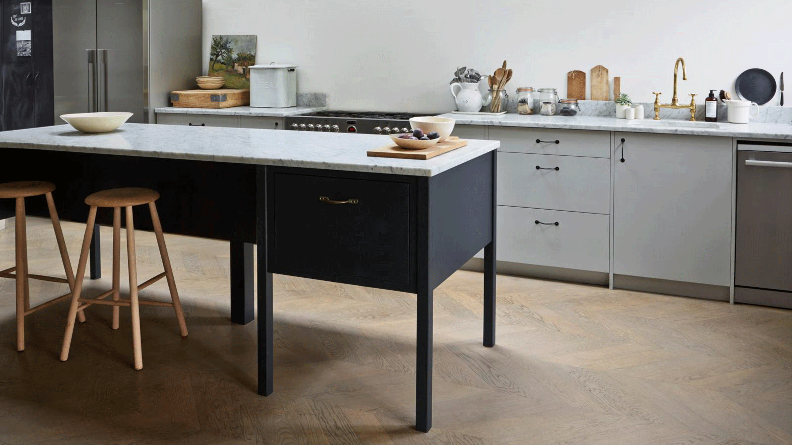 Engineered wood flooring in a kitchen with view of the kitchen island