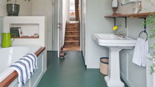 renovated bathroom with blue rubber floor