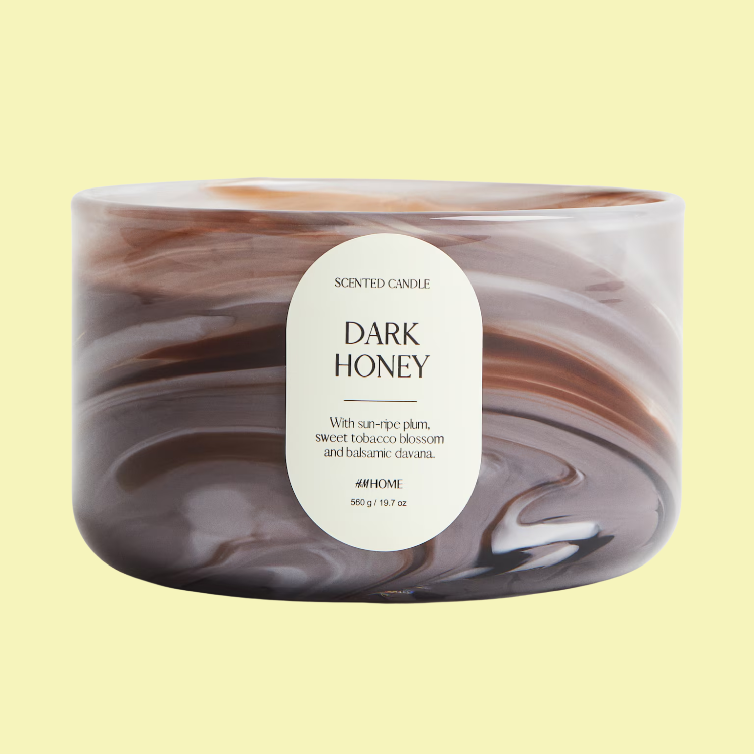 A dark honey scented candle from H&amp;amp;M in a marbled glass vessel