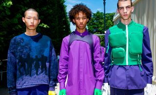 Three males modelling bright Louis Vuitton clothing