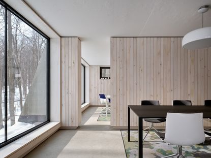 Reigo & Bauer Moves to the Country: cabin-style office in the woods in snow