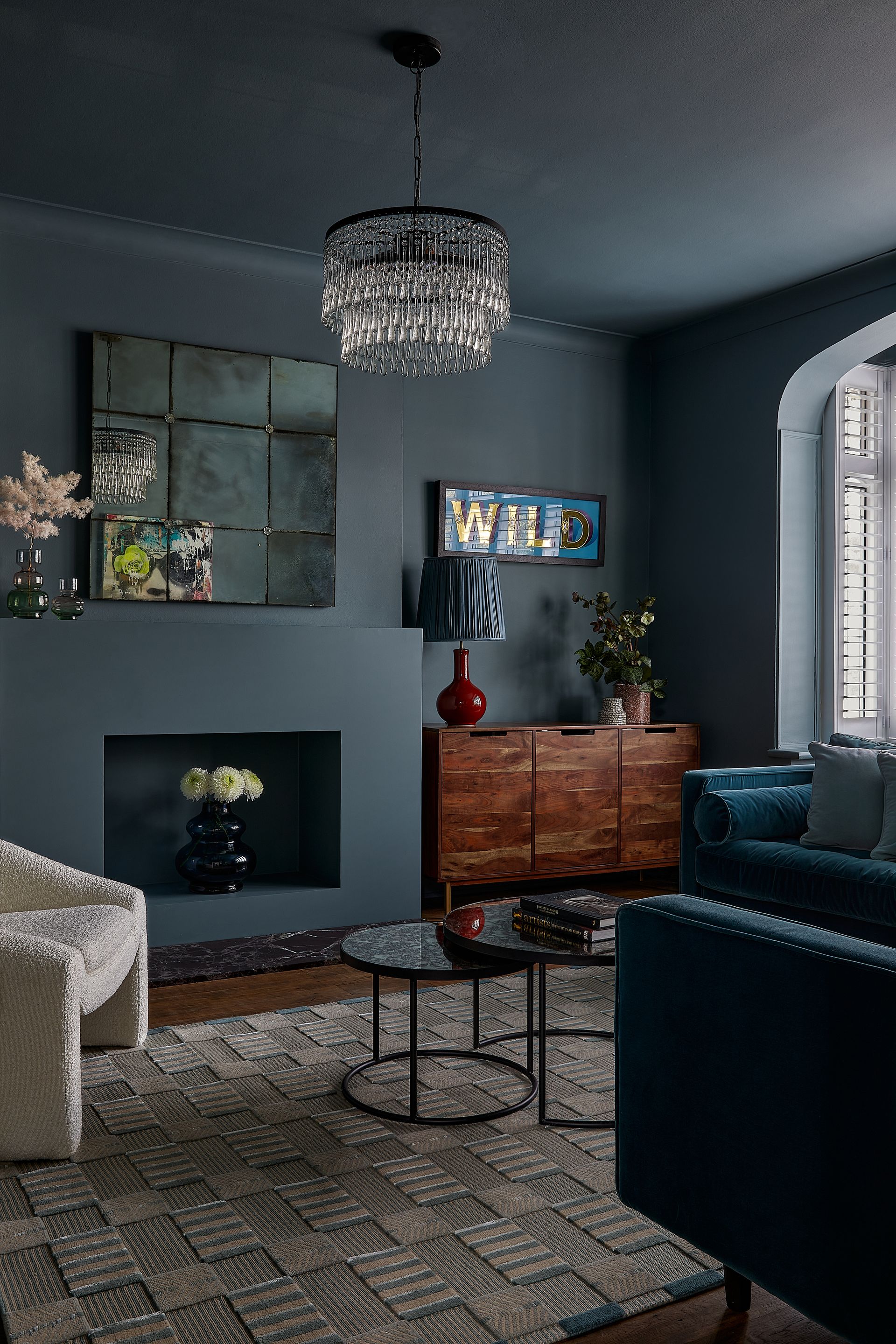 A small living room painted a deep shade of grey